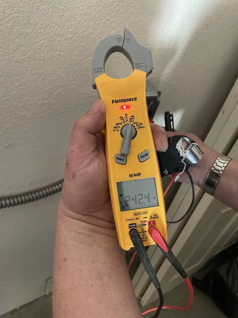 Voltage testing with clamp meter during Electrical Installation Services in Smithville